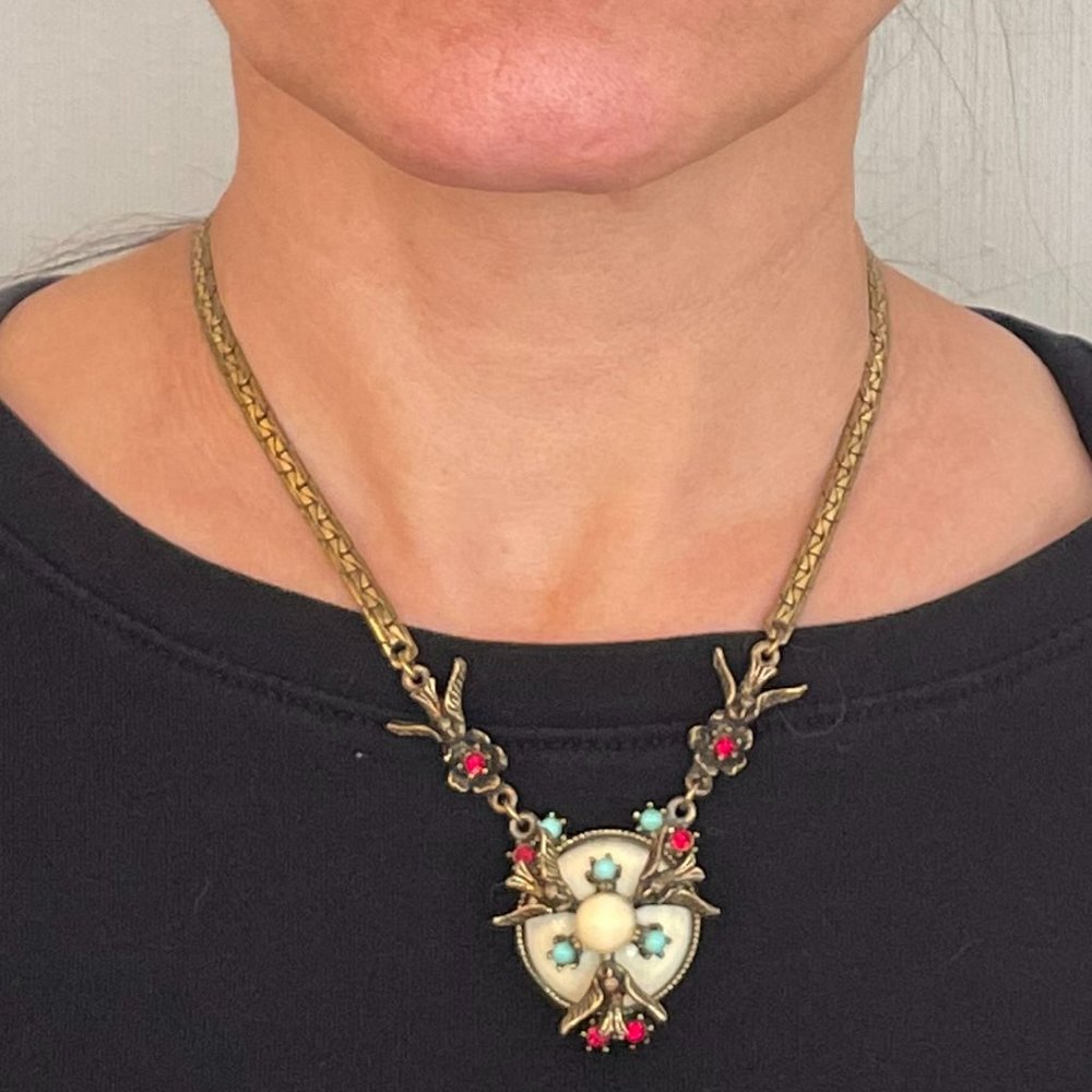 Very old necklace of birds mockingjay